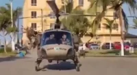 Homem levantou de banco em direção a helicóptero — Foto: Redes sociais/ Reprodução